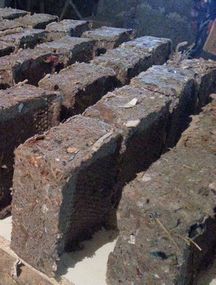 Freshly made newspaper Fire Logs, using our Multimate briquette maker